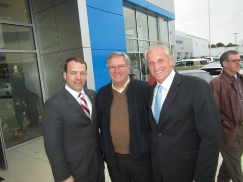 Among the community leaders and celebrities joining Michael Joe Cannon, right, for the official grand opening of Cannon Motor Company's new Oxford location on Thursday were Ole Miss Athletic Director Ross Bjork, left, Oxford Insurance Company's Tim Tatum.