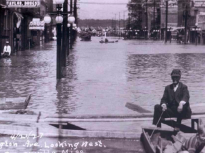 The great flood of 1927 left Greenville waterlogged for months. This photo was shot looking west on Washington Avenue. Courtesy of the Nelken Archives, Greenville, Miss.