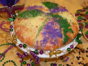 Mardi Gras King Cake, without a hole in the center, due to the dough rising.
