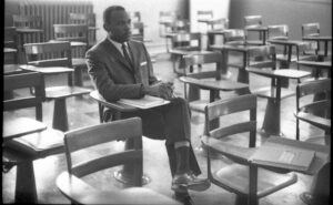 Meredith sits alone in a classroom in 1962.