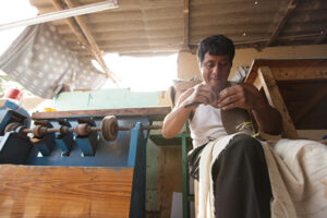 Willan crafting a pair of shoes. Photo contributed by Nisolo