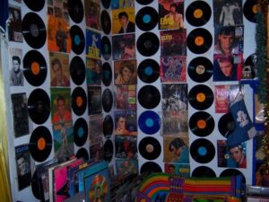Every room in the house was covered floor to ceiling in Elvis Presley records, newspapers, concert posters and more. Photo by Amelia Camurati