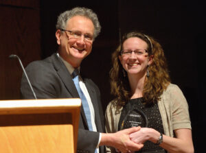 Dean Douglass Sullivan-Gonzalez presents Kate Lindsay with her Barksdale Award. Photo courtesy UM Communications