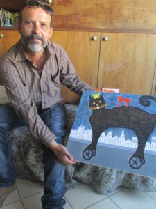 Jorge Sanfiel with the Cat on Wheels (photo by Milly West, copyright)