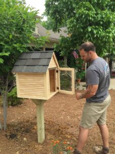 Little Free Library, before its paint job, is installed in Betty Musselwhite's yard.