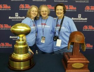 Sandra Murray (left) soak in the afterglow of 2014 season with these trophies.