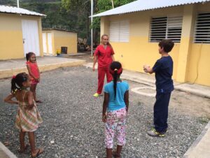 Sarah and John West entertain the children while they wait for their dental appointments.