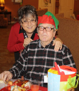 95-year-old John Kelley celebrates Christmas at Hermitage Gardens in Oxford with his daughter, Elnora Castleberry