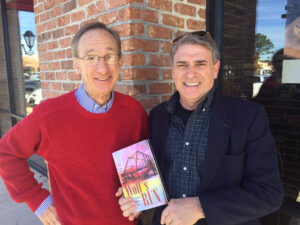 Louis Park (right), author of the novel Wolf's Run, visits with Ole Miss Journalism faculty member, Bill Rose. Park and Rose, both UM alums, formerly worked for Florida newspapers, most recently the Palm Beach Post. Photo and video by Ed Meek