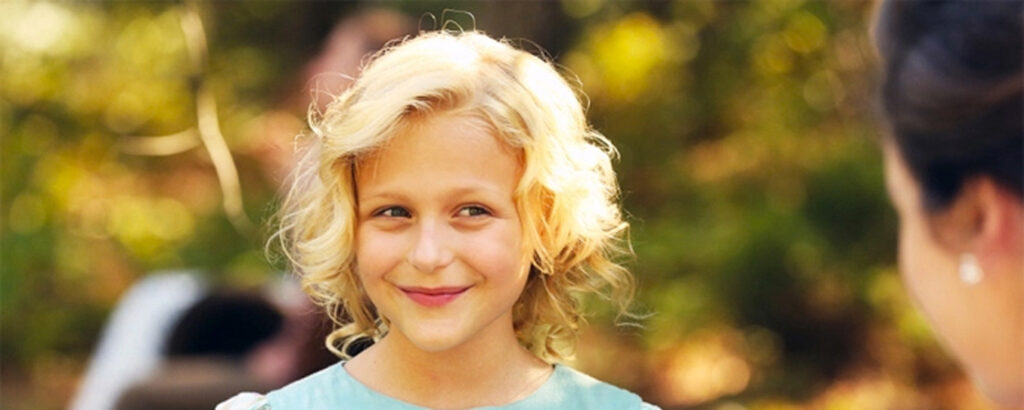 Newcomer Alyn Lind portrays the nine-year-old Dolly Parton in 'Coat of Many Colors'