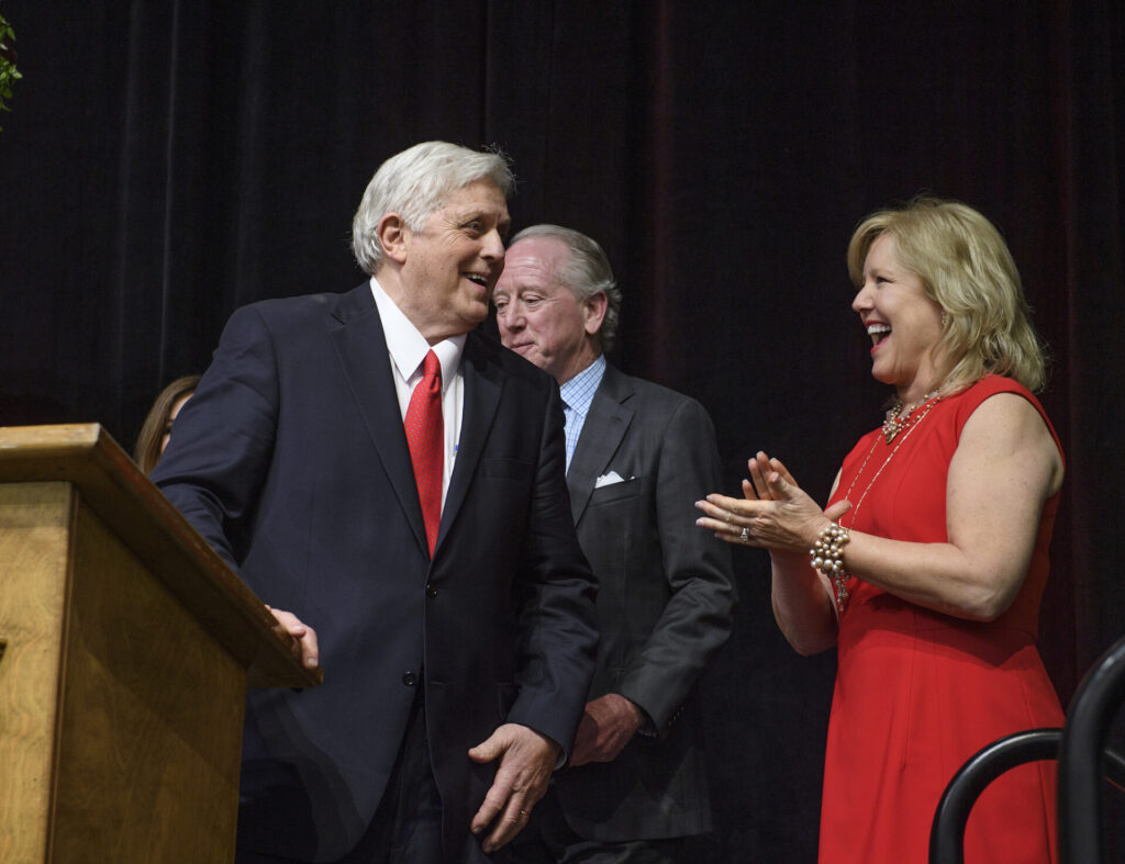 Chancellor Emeritus Robert C. Khayat laughs with Ole Miss Women's Council chair Karen Moore after being surprised with a birthday cake during the Ole Miss Women's Council Legacy Awards Banquet. Khayat is the 2016 recipient of the award. Photo by Thomas Graning/Ole Miss Communications