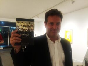 Louis Bourgeious poses with the second book from VOX Press' Prison Writes Initiative. 