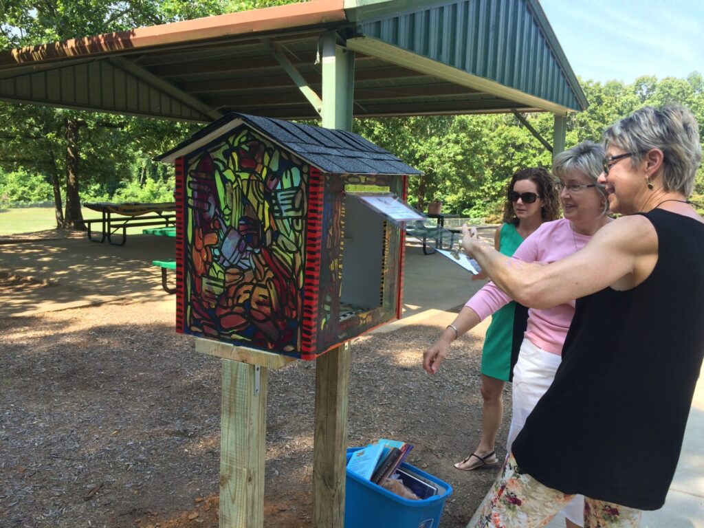 Julie Chapwick and other members of Woman's Book Club began filling the Little Free Library in Price Hill Park. 