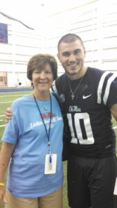 Jane Montgomery Ford with Ole Miss' quarterback Chad Kelly.