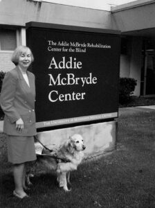 Karen Brown with one of her three guide dogs at Addie McBryde Center. 