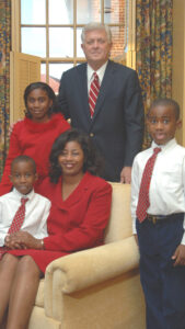 Jacquline A. Vinson and her family with former UM chancellor Robert Khayat. (photo from Ole Miss Newsdesk) 