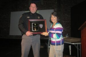 Captain Alan Ivy receiving 2015 Community Service Award presented by Captain Libby Lytle. (Photo from Facebook.com/Oxford Police Department) 