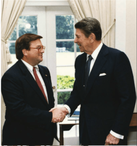 Fritts shakes hands with President Ronald Reagan in the White House. 