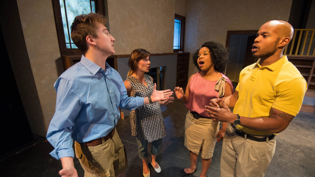 Daniel Schultz (left), Faith Janicki, Tysianna Jones and Jonathan Orange rehearse for a scene from the Ole Miss Theatre production of 'Clybourne Park,' opening Sept. 23 in Meek Hall Auditorium.  Photo by Kevin Bain/Ole Miss Communications