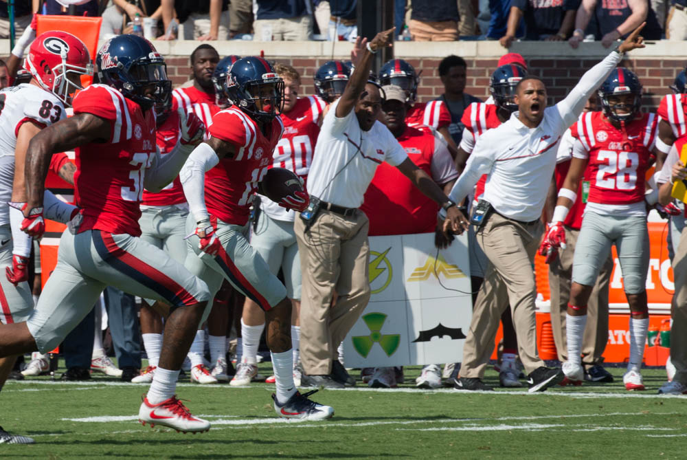 Sideline Coaches point the way for Ole Miss' Derrick Jones 52 yard pick six as the Rebels take on the Georgia Bulldogs Saturday at Vaught-Hemmingway stadium.
