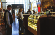 Customers ogle the tantalizing display of chocolates at the Bedre Chocolate Factory.