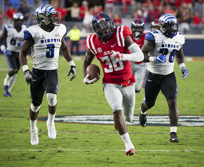 Ole Miss’ Zedrick Woods picked off Ferguson's pass and takes it 31 yards for a score, Ole Miss leads 14-0. Photo courtesy of Bill Barksdale