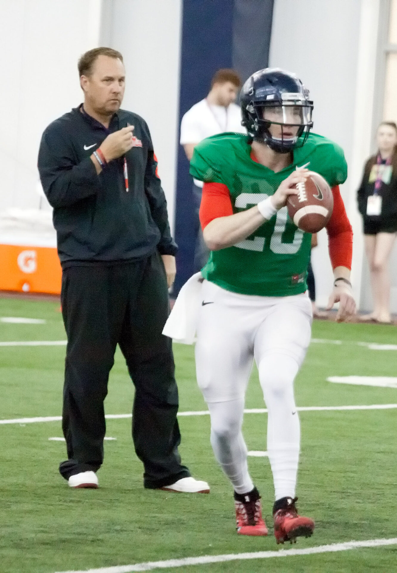 Shea Patterson drops back for a pass as Coach Hugh Freeze looks on at the Indoor Practice Facility for the Spring Rebels Scrimmage.