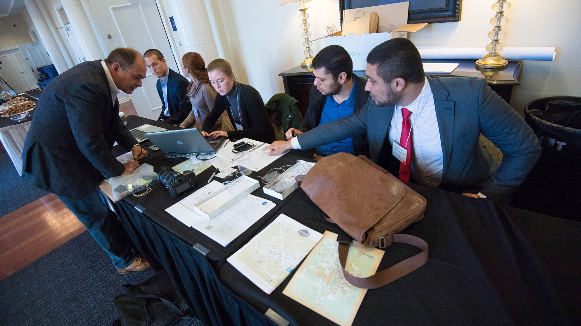 Engineering students help UM prof Alexander Yakovlev just before the Advanced Materials conference at the Inn at Ole Miss.  Photo by Kevin Bain/Ole Miss Communications