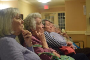 Residents wind down the day by watching a movie 