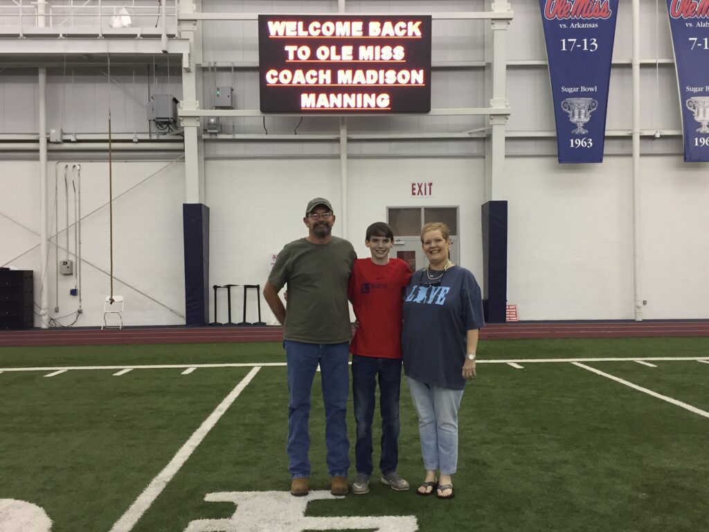 Madison with his parents, Donna & Mike Manning