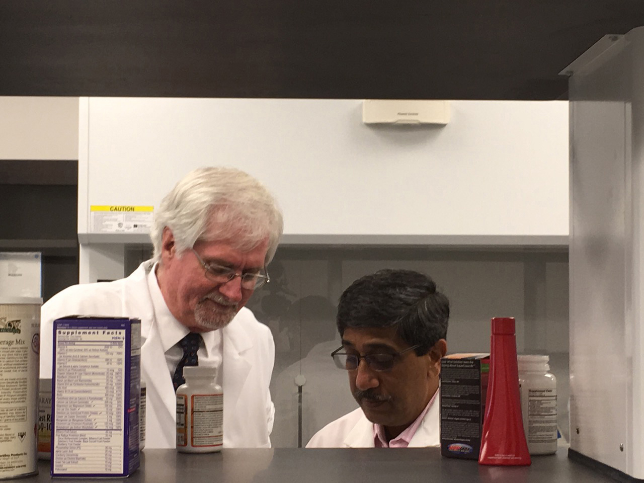 NCNPR Director Larry Walker (left) and Associate Director Ikhlas Khan inspect dietary supplements as part of a partnership with the U.S Food and Drug Administration. Photo by Sydney Slotkin DuPriest