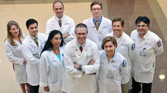 Abdominal transplant team members at the UM Medical Center include (front row, from left) Ashley Seawright, nurse practitioner, Dr. Truman Earl, Dr. Fauzia Butt, Dr. Christopher Anderson, Dr. Iasmina Craici, Dr. Kenneth Kokko and Dr. Mehul Dixit, and (back row, from left) Dr. Brian Borg and Dr. Steven Wagner. Photo by Jay Ferchaud.