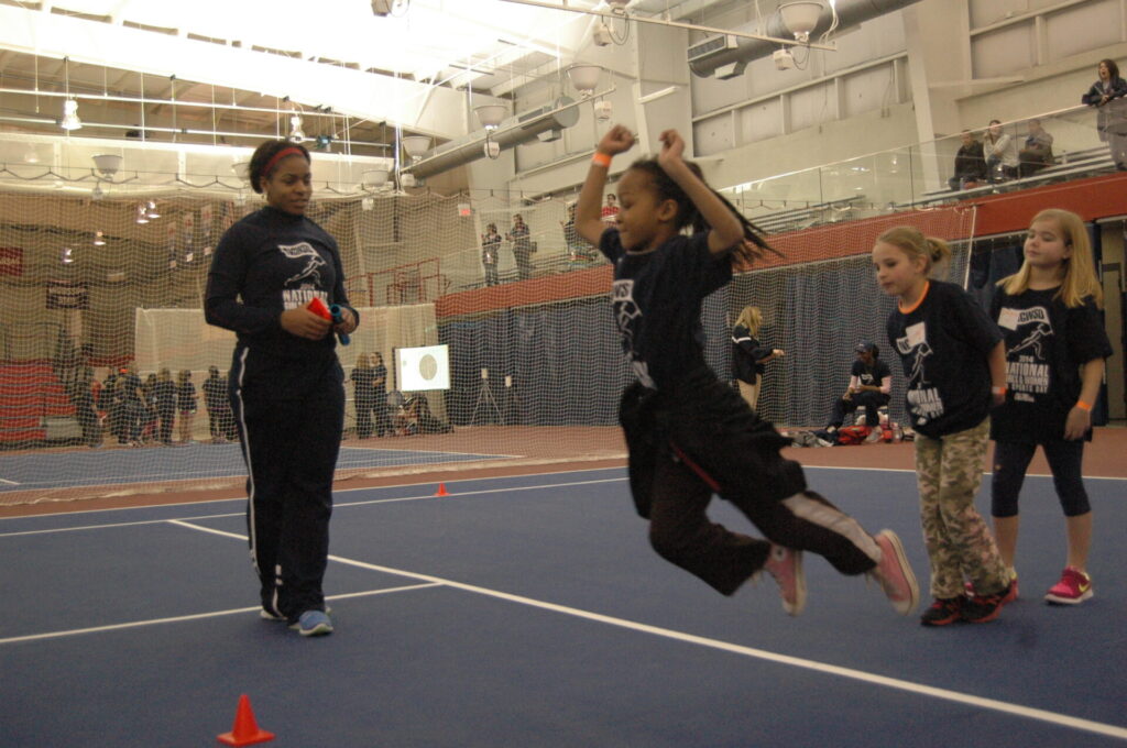 Freshman Kenya Wheeler instructs the girls on how to long jump.