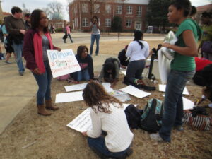 Rally organizers brought poster board and markers so students could make signs to show support. 