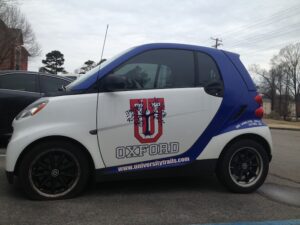 University Trails uses their customized Smart Car to promote their apartments around town.