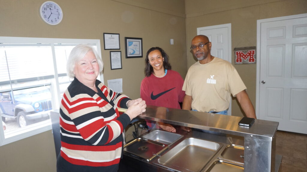Peggy Sneed of Oxford is a happy customer, pictured here with the owners, Mike and Regarner Thompson. 