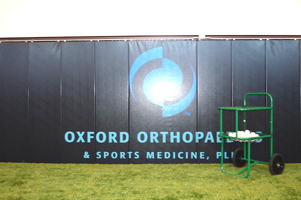The Oxford Orthopaedic & Sports Medicine logo on the practice facility wall.