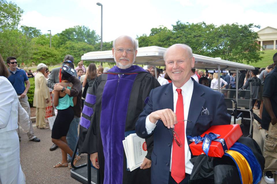 Charlie Mitchell, assistant dean, and Will Norton after graduation last May
