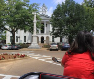 Ashley Hoffner pedals by the Courthouse. Photo taken 8/12/14. 