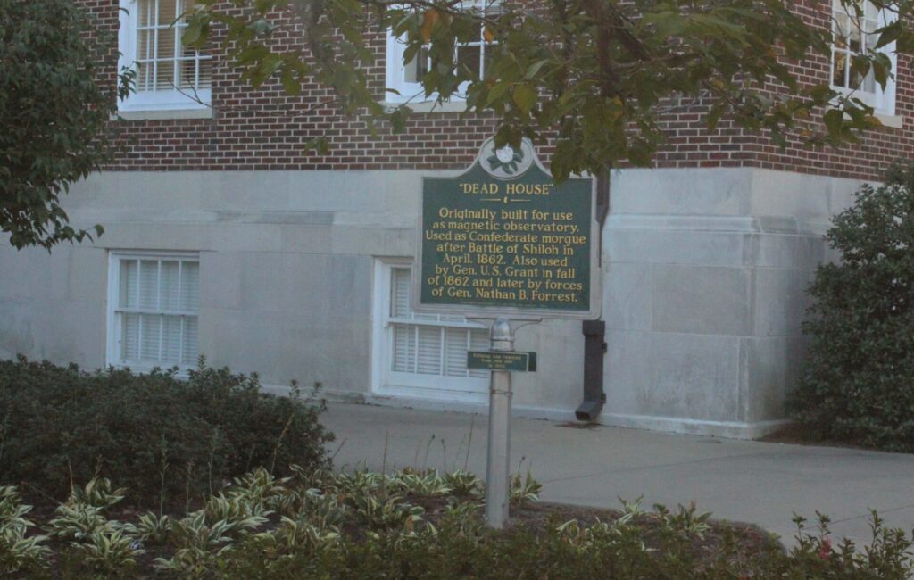 The "Dead House" plaque stands outside of the Farley Hall. 