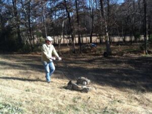 Regions employee cuts grass