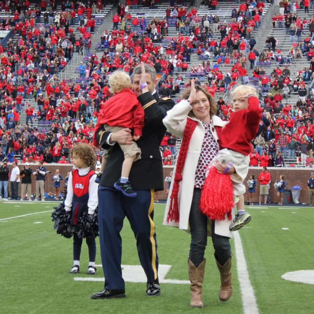 A military family threw up the fin while on-field. Hotty Toddy! 