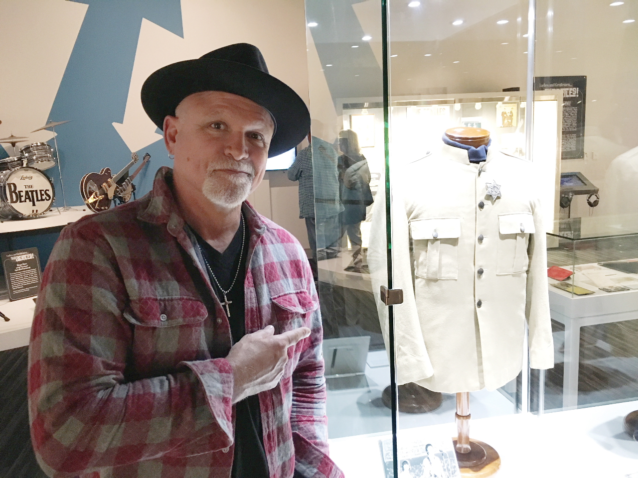 Rocker, Derek St. Holmes standing next to the jacket worn by Paul McCartney at the famous Shea Stadium concert which is one of many Beatles’ items on display at GRAMMY Museum Mississippi in Cleveland.