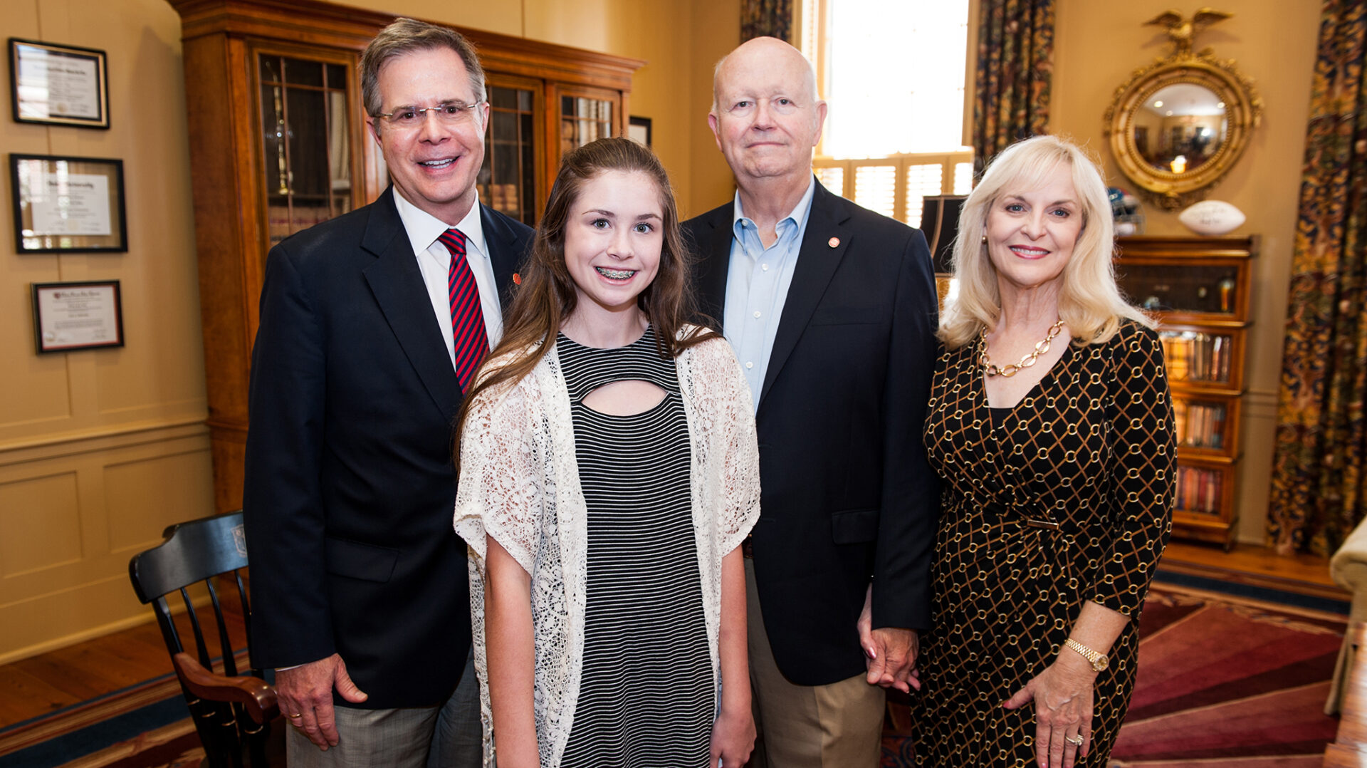 UM Chancellor Jeffrey Vitter, left, visits with Paige, Terry and Cindy Crawford to thank them for the Mitchell Crawford Eagle Scout Scholarship Endowment. The scholarship will assist business students with first preference going to Eagle Scouts. UM photo by Bill Dabney