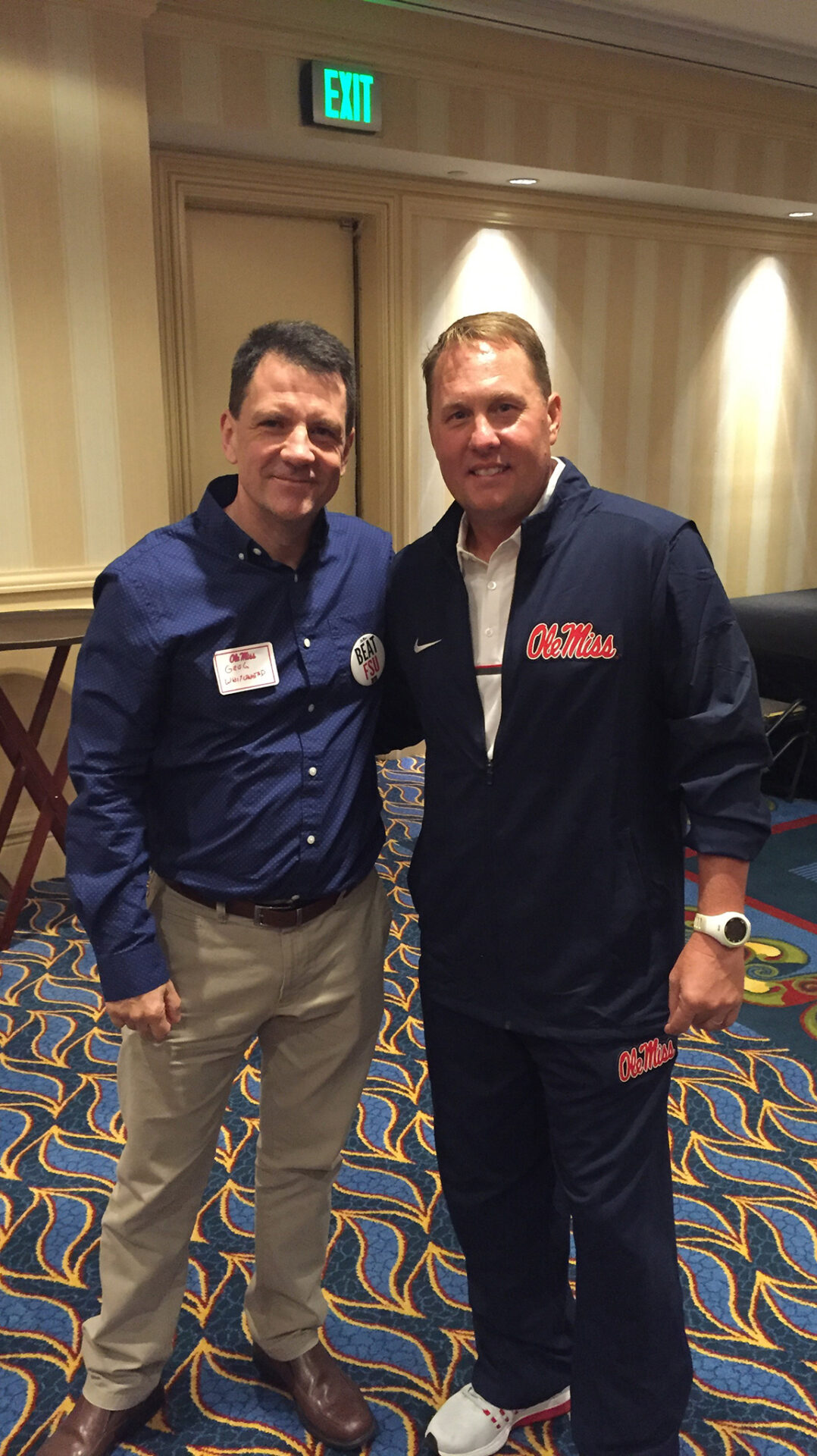 UM alumnus Greg Whitehead, left, meets with football Coach Hugh Freeze. Whitehead has established an endowment to provide ongoing scholarships for Ole Miss student-athletes. Courtesy photo
