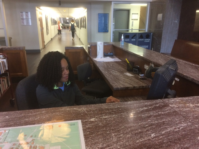 Tesha Cistrunk types away during her shift as a desk assistant at the J.D. Williams Library. Photo by Jack Hall.