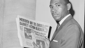 James Meredith holds a newspaper as he attempts to register at the University of Mississippi. Bettmann / Getty Images