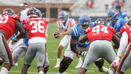 Matt Corral dropping back to pass