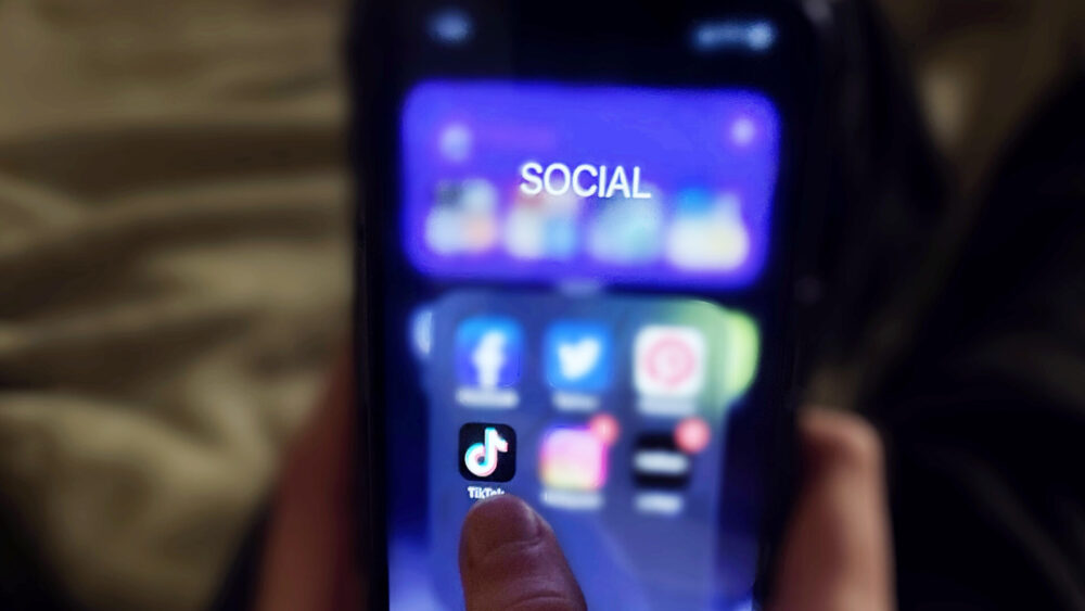 Photo of phone showing TikTok app