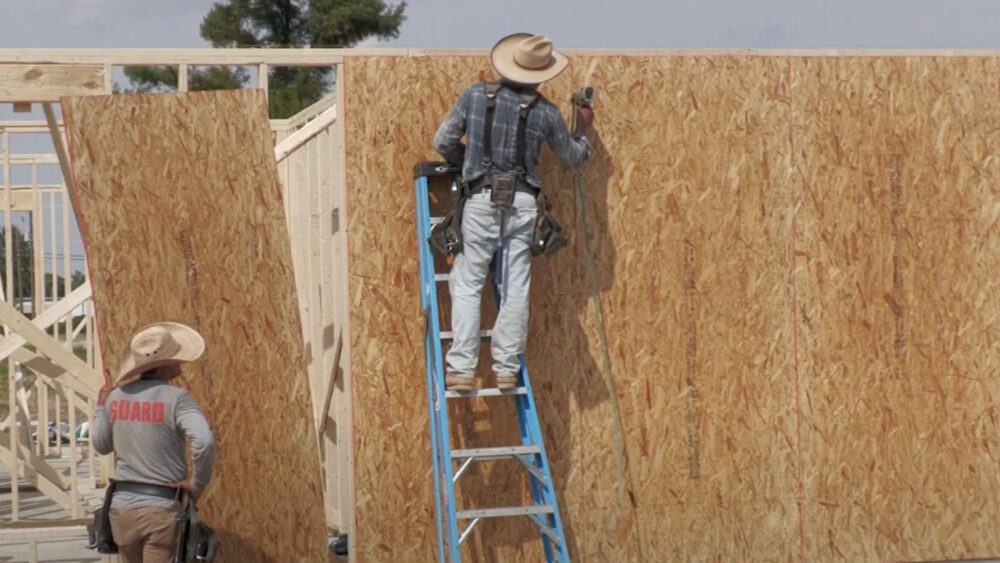 Men building a home